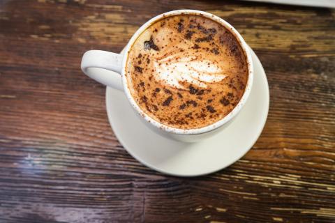 Coffee cup on wooden table