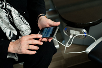 Executive holding smartphone