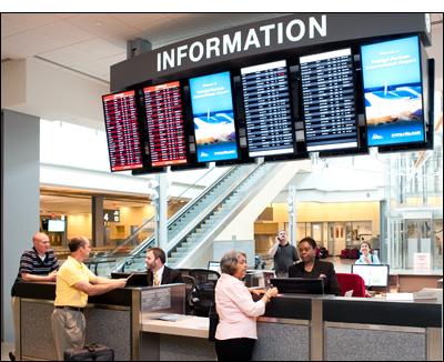 Photo of a customer being assisted at the Information Desk at Terminal 2